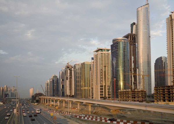 UAE, Dubai Jumeirah Lake Towers beside a Road